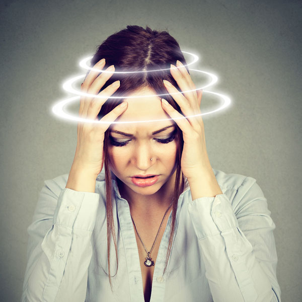 woman with head spinning concept